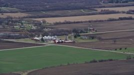 4K aerial stock footage of barns and silos at a farm in Union Grove, Wisconsin Aerial Stock Footage | AX0167_0044