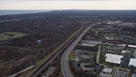4K aerial stock footage of flying over highway toward a nature preserve in Lake Bluff, Illinois Aerial Stock Footage | AX0167_0060