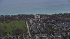4K aerial stock footage of flying by Fort Sheridan Water Tower and homes in Highland Park, Illinois Aerial Stock Footage | AX0167_0063