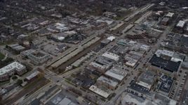 4K aerial stock footage of flying over shops in the center of Highland Park, Illinois Aerial Stock Footage | AX0167_0064