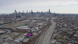 4K aerial stock footage of following light freeway traffic and the river toward the Downtown Chicago skyline, Chicago, Illinois Aerial Stock Footage | AX0167_0082