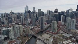 4K aerial stock footage of following the Chicago River toward skyscrapers in Downtown Chicago, Illinois Aerial Stock Footage | AX0167_0085