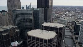 4K aerial stock footage of flying by skyscrapers toward Willis Tower in Downtown Chicago, Illinois Aerial Stock Footage | AX0167_0087