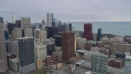 4K aerial stock footage of a reverse view of skyscrapers and city buildings in Downtown Chicago, Illinois Aerial Stock Footage | AX0167_0089