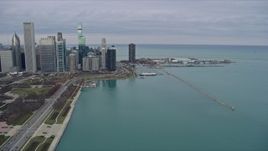 4K aerial stock footage of following Lake Shore Drive toward skyscrapers and Navy Pier, Downtown Chicago, Illinois Aerial Stock Footage | AX0167_0093