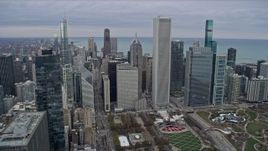 4K aerial stock footage of tilting from Grant Park to nearby skyscrapers, Downtown Chicago, Illinois Aerial Stock Footage | AX0167_0095