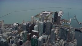 4K aerial stock footage of flying over skyscrapers to approach Navy Pier, Downtown Chicago, Illinois Aerial Stock Footage | AX0167_0103
