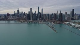 4K aerial stock footage of the city's waterfront skyline and Grant Park, seen from Lake Michigan, Downtown Chicago, Illinois Aerial Stock Footage | AX0167_0107