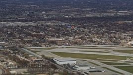 4K aerial stock footage a commercial jet just after lifting off from Chicago Midway International Airport, Illinois Aerial Stock Footage | AX0168_0013