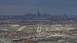 4K aerial stock footage of the Downtown Chicago skyline and Chicago Midway International Airport, Illinois Aerial Stock Footage | AX0168_0015