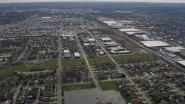 4K aerial stock footage of flying by suburban homes near warehouse buildings in Bridgeview, Illinois Aerial Stock Footage | AX0168_0016