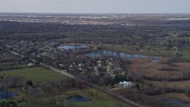4K aerial stock footage of upscale homes near small lakes in a quiet neighborhood in Lemont, Illinois Aerial Stock Footage | AX0168_0025