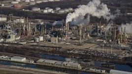 4K aerial stock footage of passing by an oil refinery in Romeoville, Illinois Aerial Stock Footage | AX0169_0002