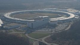 4K aerial stock footage of a reverse view of the Advanced Photon Source at the Argonne National Laboratory in Lemont, Illinois Aerial Stock Footage | AX0169_0007