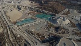 4K aerial stock footage of flying past ponds at a quarry in Hodgkins, Illinois Aerial Stock Footage | AX0169_0013
