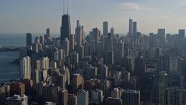 4K aerial stock footage of flying by skyscrapers and city buildings around John Hancock Center, Downtown Chicago, Illinois Aerial Stock Footage | AX0169_0028