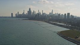 4K aerial stock footage of a wide view of lakefront skyscrapers and city buildings seen from Lake Michigan, Downtown Chicago, Illinois Aerial Stock Footage | AX0169_0029