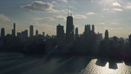 4K aerial stock footage tilt from Lake Michigan to reveal John Hancock Center and skyscrapers, Downtown Chicago, Illinois Aerial Stock Footage | AX0169_0031