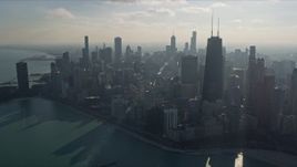 4K aerial stock footage of passing by the city's downtown skyscrapers, seen from Lake Michigan, Downtown Chicago, Illinois Aerial Stock Footage | AX0169_0032