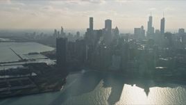 4K aerial stock footage of passing by the city's downtown skyscrapers, reveal Navy Pier, Downtown Chicago, Illinois Aerial Stock Footage | AX0169_0033