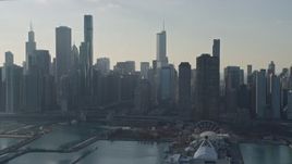 4K aerial stock footage tilt from lake to reveal Navy Pier and city's downtown skyline, Downtown Chicago, Illinois Aerial Stock Footage | AX0169_0036