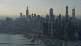 4K aerial stock footage of flying past waterfront skyscrapers and Grant Park, Downtown Chicago, Illinois Aerial Stock Footage | AX0169_0037