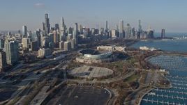 4K aerial stock footage approach Soldier Field, Field Museum, and the city's skyline, Downtown Chicago, Illinois Aerial Stock Footage | AX0169_0041