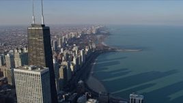 4K aerial stock footage fly past John Hancock Center to reveal and approach Lincoln Park, Downtown Chicago, Illinois Aerial Stock Footage | AX0169_0046