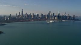 4K aerial stock footage of a wide reverse view of the city's downtown skyline seen from Lake Michigan, Downtown Chicago, Illinois Aerial Stock Footage | AX0169_0053
