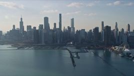 4K aerial stock footage of approaching the city's downtown skyline and Chicago River, Downtown Chicago, Illinois Aerial Stock Footage | AX0169_0055