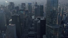4K aerial stock footage of following the Chicago River past skyscrapers, Downtown Chicago, Illinois Aerial Stock Footage | AX0169_0056