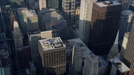 4K aerial stock footage of circling Atrium Mall, Chicago City Hall rooftop, near skyscrapers, Downtown Chicago, Illinois Aerial Stock Footage | AX0169_0060