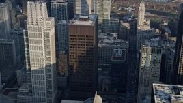 4K aerial stock footage of Grant Thornton Tower and Richard J. Daley Center skyscrapers, Downtown Chicago, Illinois Aerial Stock Footage | AX0169_0061