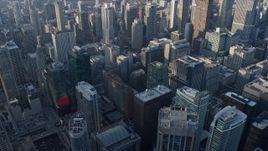 4K aerial stock footage of flying over and tilting to downtown skyscrapers, Downtown Chicago, Illinois Aerial Stock Footage | AX0169_0065