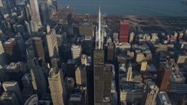 4K aerial stock footage approach the top of Willis Tower and tilt to a bird's eye view of the skyscraper, Downtown Chicago, Illinois Aerial Stock Footage | AX0169_0082