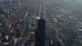 4K aerial stock footage fly toward the top of Willis Tower and tilt to a bird's eye view of the skyscraper, Downtown Chicago, Illinois Aerial Stock Footage | AX0169_0084