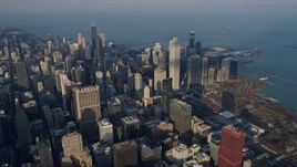 4K aerial stock footage reverse view of skyscrapers and city buildings in the downtown area of the city, Downtown Chicago, Illinois Aerial Stock Footage | AX0169_0085