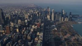 4K aerial stock footage of flying across the downtown area of the city by Grant Park, Downtown Chicago, Illinois Aerial Stock Footage | AX0169_0087