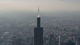 4K aerial stock footage of orbiting the top of Willis Tower, Downtown Chicago, Illinois Aerial Stock Footage | AX0169_0093
