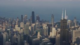 4K aerial stock footage passing tall skyscrapers and city buildings in the downtown area of the city, Downtown Chicago, Illinois Aerial Stock Footage | AX0169_0095