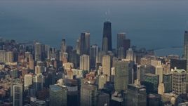 4K aerial stock footage flyby tall skyscrapers and city buildings in the downtown area of the city, Downtown Chicago, Illinois Aerial Stock Footage | AX0169_0096