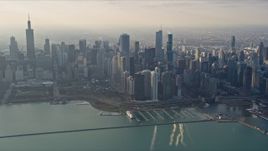 4K aerial stock footage of flying past Downtown Chicago, Illinois, seen from Lake Michigan Aerial Stock Footage | AX0169_0100
