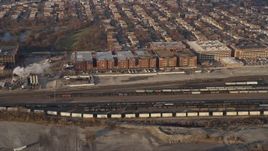 4K aerial stock footage of a train yard and factory buildings in Southwest Side Chicago, Illinois Aerial Stock Footage | AX0169_0104