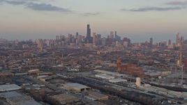 4K aerial stock footage wide view of the Downtown Chicago skyline seen from West Side at sunset, Illinois Aerial Stock Footage | AX0170_0007