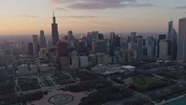 4K aerial stock footage fly past the Downtown Chicago skyline and Grant Park at sunset, Illinois Aerial Stock Footage | AX0170_0014