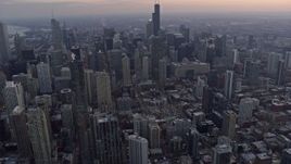 4K aerial stock footage flyby skyscrapers at sunset in Downtown Chicago, Illinois Aerial Stock Footage | AX0170_0026