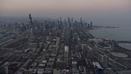 4K aerial stock footage of approaching downtown from South Side at sunset, Downtown Chicago, Illinois Aerial Stock Footage | AX0170_0039