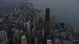 4K aerial stock footage of following Michigan Avenue past John Hancock Center at sunset, Downtown Chicago, Illinois Aerial Stock Footage | AX0170_0041