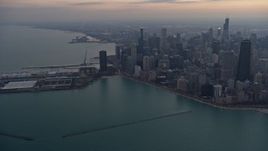 4K aerial stock footage of panning from Navy Pier to approach downtown at sunset, Downtown Chicago, Illinois Aerial Stock Footage | AX0170_0042