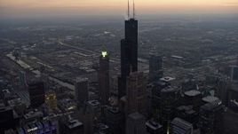 4K aerial stock footage fly over Trump Tower to approach Willis Tower and West Side at sunset, Downtown Chicago, Illinois Aerial Stock Footage | AX0170_0044